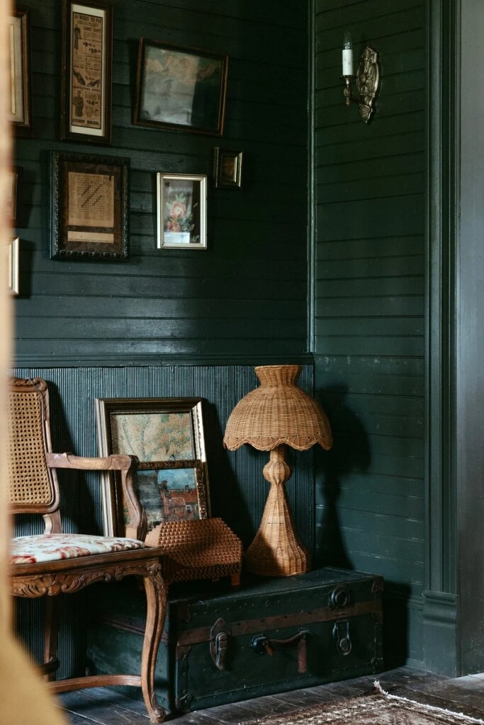 vintage farmhouse with deep green walls and rattan - michelle