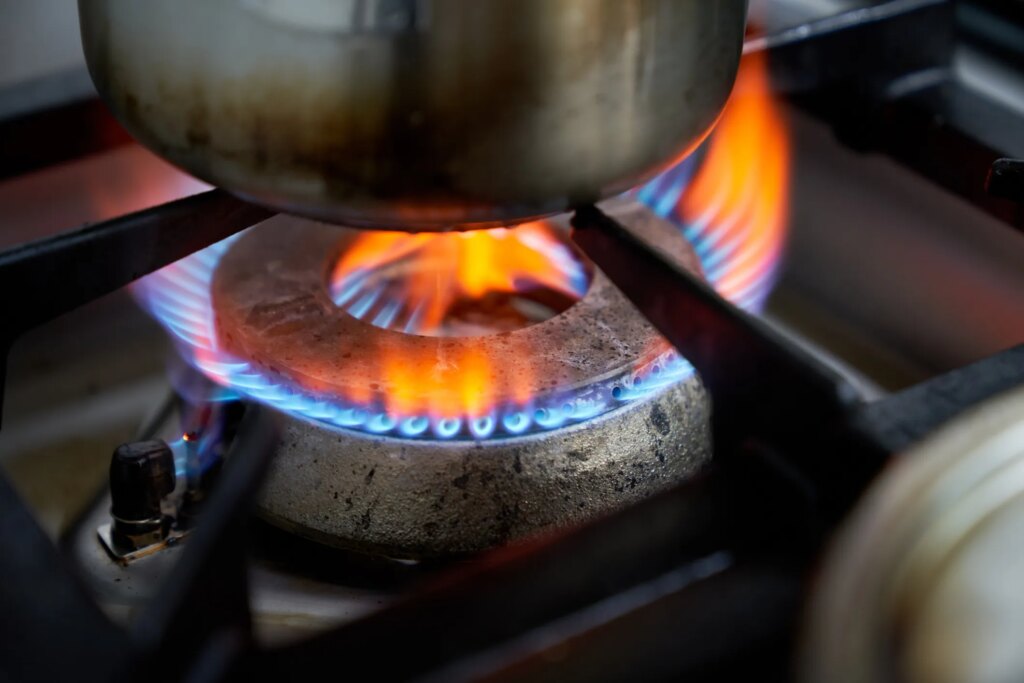 A close-up of a gas stove burner flame.